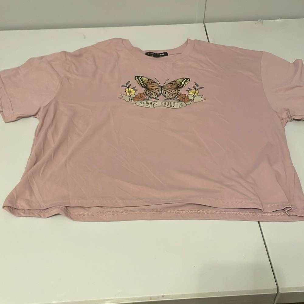 rose gold “always revolving” loose crop top.